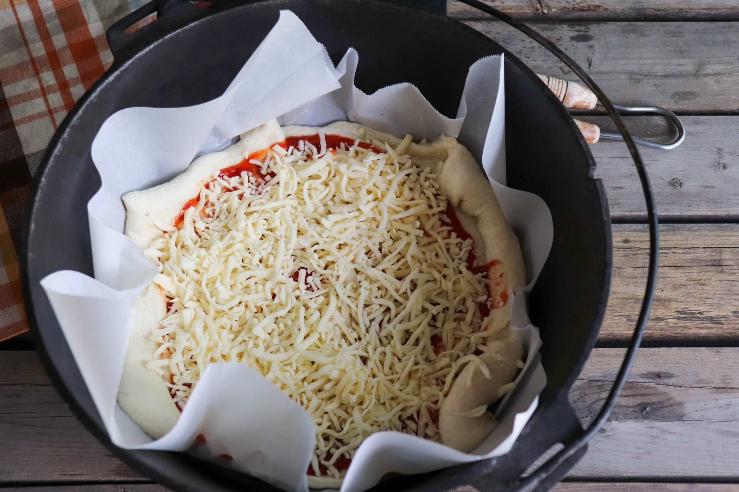 https://campfirefoodie.com/wp-content/uploads/2021/05/Dutch-Oven-Pizza-Recipe-6-scaled.jpg