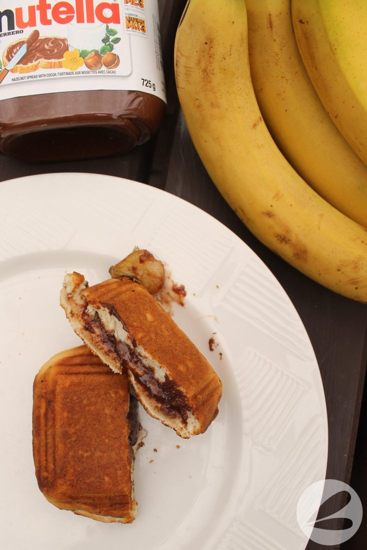 https://campfirefoodie.com/wp-content/uploads/2023/02/Pie-Iron-Nutella-Banana-Biscuits-009-scaled-1-735x1102.jpg