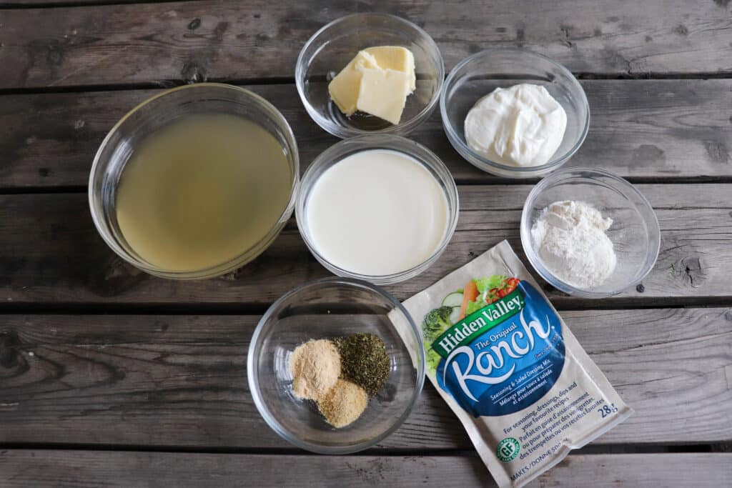 Ingredients for ranch chicken in clear glass bowls.