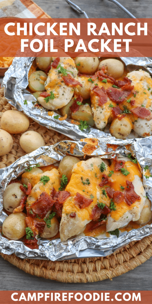 Chicken covered in bacon bits and melted cheese in foil packets.