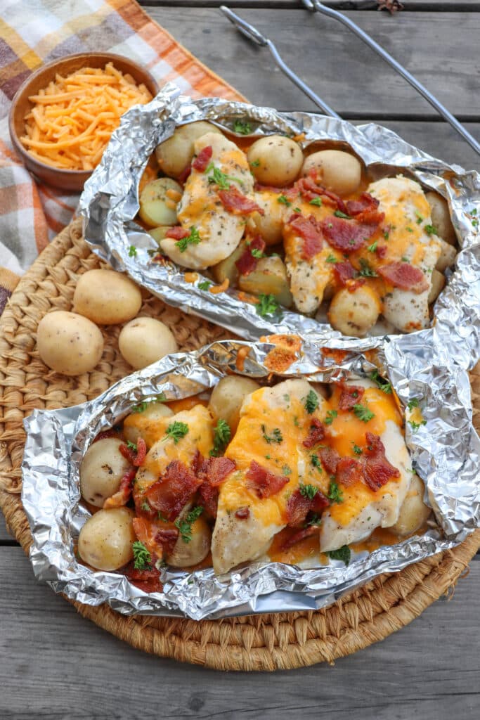 Chicken bacon ranch foil packs on a picnic table.