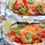 Salsa and cheese over chicken in foil packets.