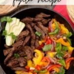 A skillet filled with cooked steak, colorful sliced bell peppers, and onion, garnished with avocado slices and cilantro. The text on the image reads, Skillet Steak Fajita Recipe and the website name Campfire Foodie.