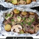 Two foil packets with steak, potatoes, and mushrooms, garnished with chopped herbs. The packets are open, revealing cooked ingredients on a grill. Text at the bottom reads: Foil Packet Steak & Potatoes with a website link campfirefoodie.com.