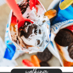 A bag filled with crushed Oreos, white cream, and gummy worms, eaten with a red spoon. The image promotes walking Oreo dirt pie from campfirefoodie.com.