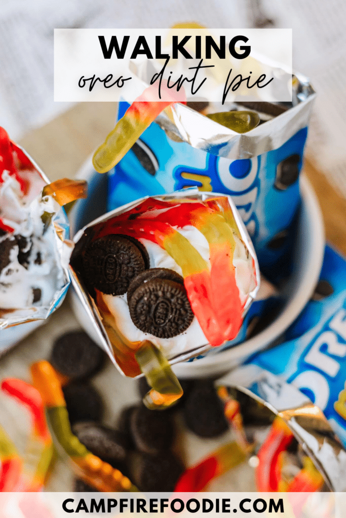 Overhead view of Oreo snack packs filled with whipped cream, mini Oreo cookies, and colorful gummy worms, labeled Walking Oreo Dirt Pie. The website campfirefoodie.com appears at the bottom.