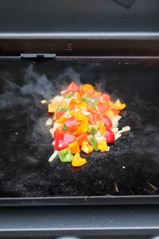 A pile of vegetables on a grill.